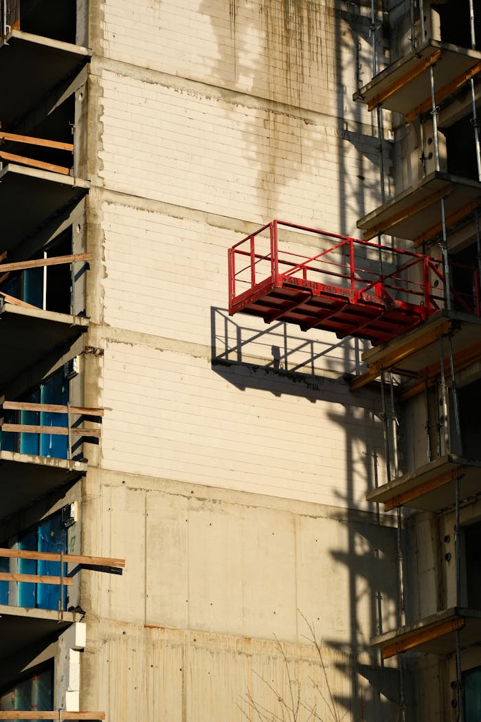 services-03 urban-construction-site-with-red-scaffolding-35197576